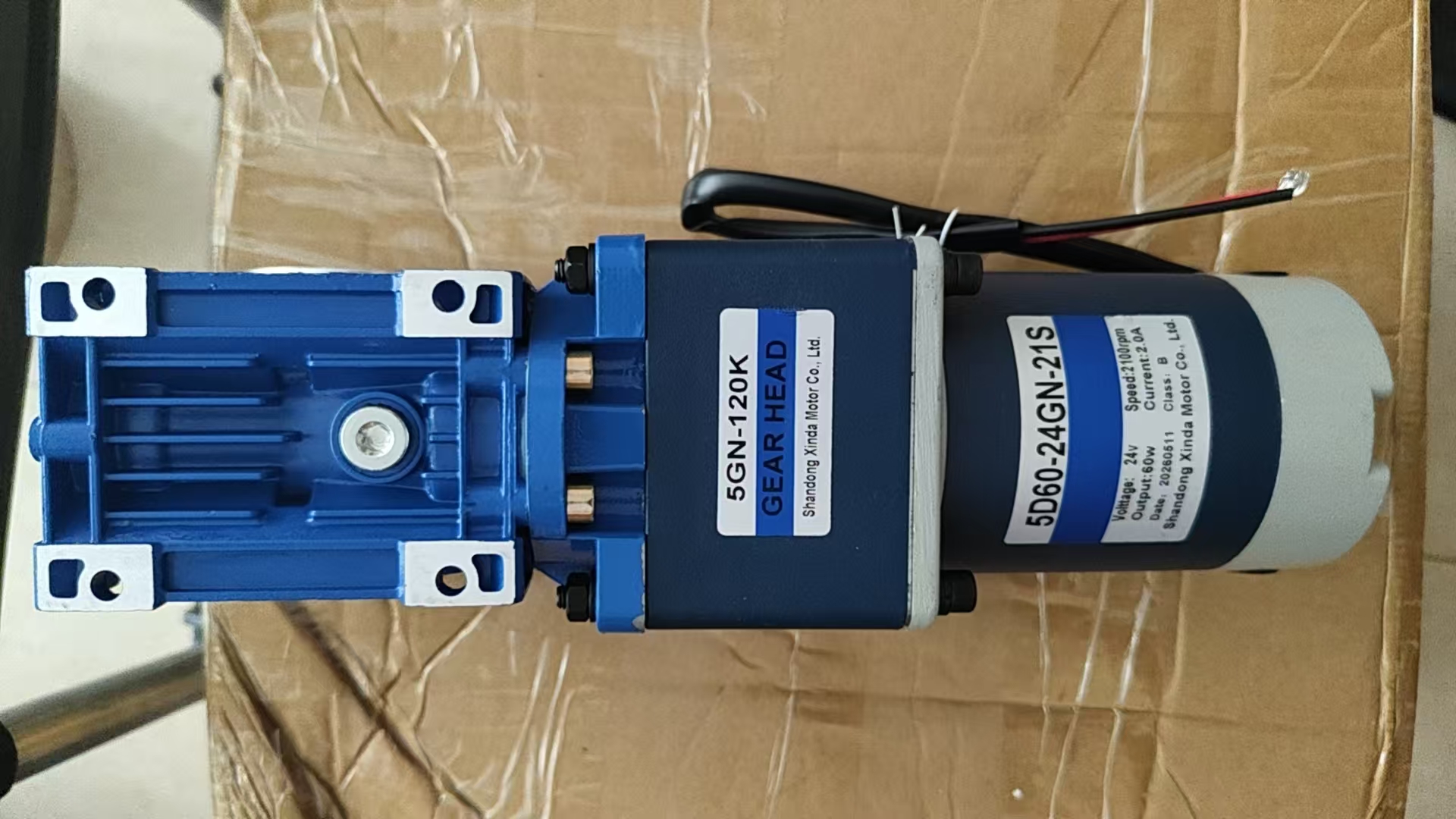 What is the purpose of the torque arm on a motor?