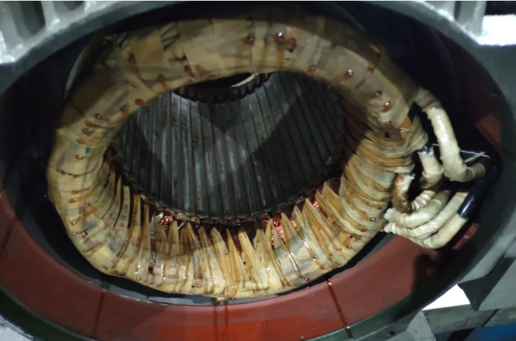 What causes the insulating varnish to peel off after the motor windings have been impregnated?